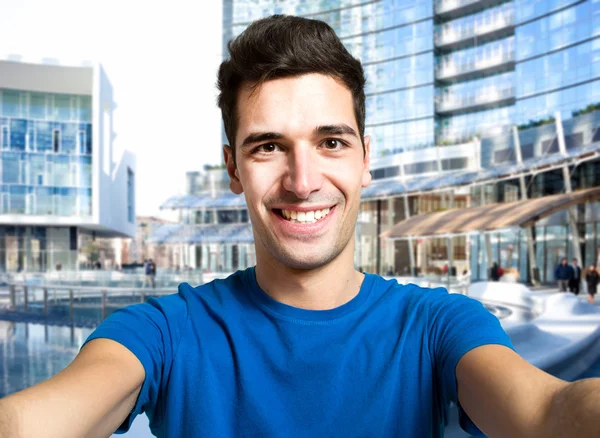 Young man in urban setting — Stock Photo, Image
