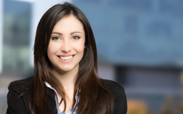 Young businesswoman in modern office — Stock Photo, Image