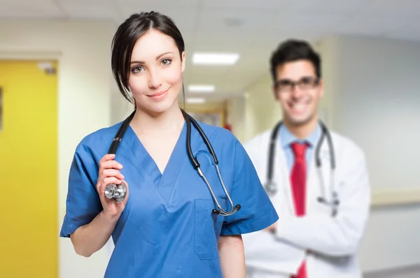 Couple of doctors at hospital — Stock Photo, Image