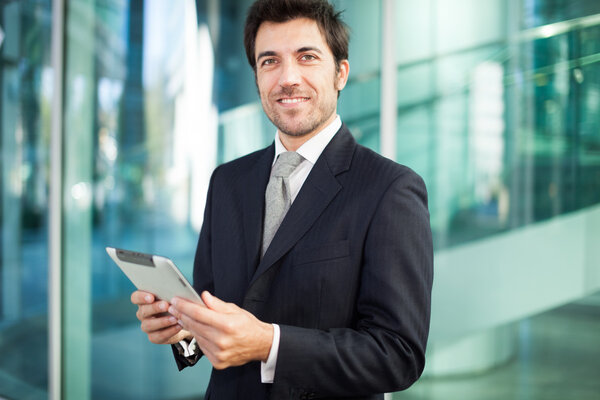 Businessman using his tablet computer