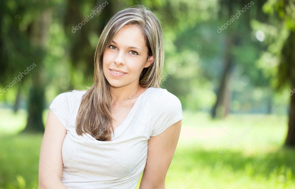 Smiling woman in a park