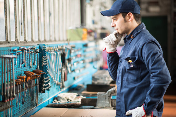 Worker searching for right wrench