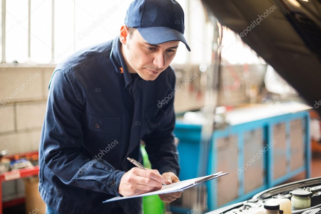 Mechanic at work in garage
