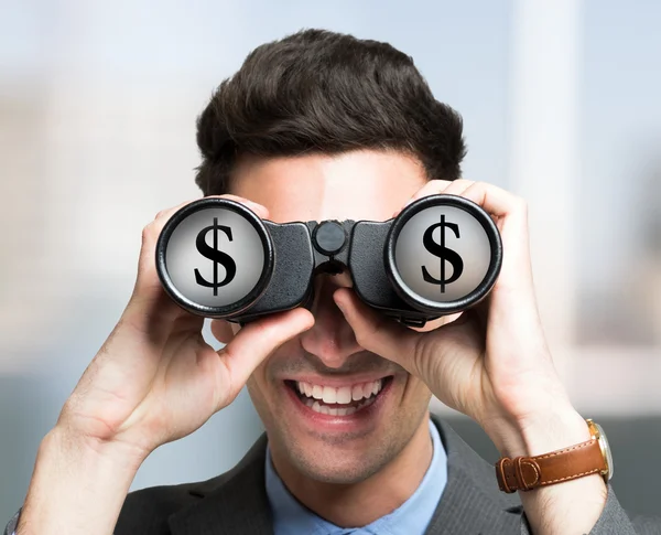 Businessman looking through binoculars — Stock Photo, Image