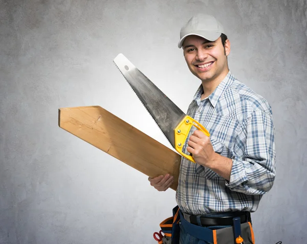 Carpenter holding wood planks — Stock Photo, Image