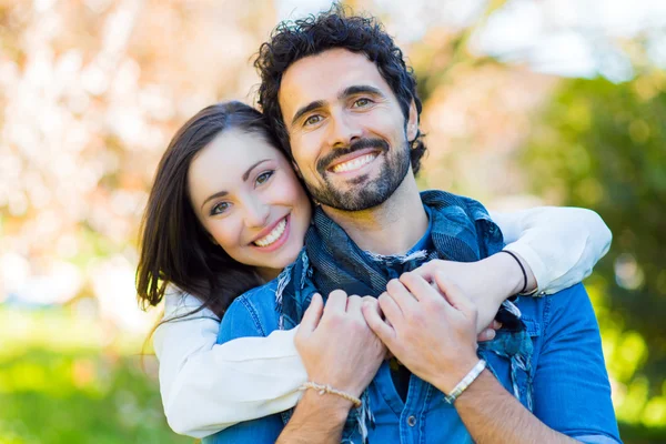 Couple relaxing on grass