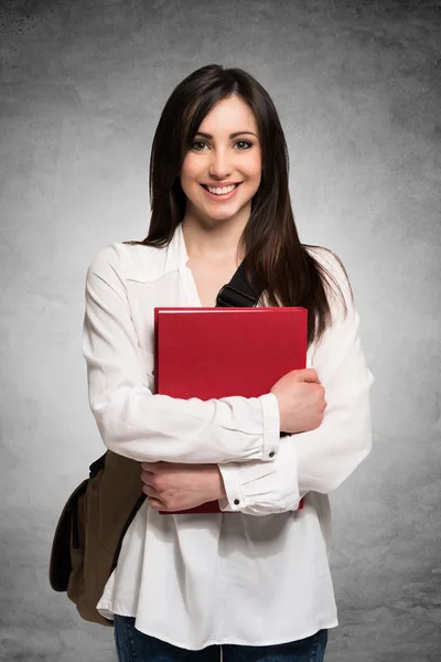 Young woman holding a book — Stock Photo, Image