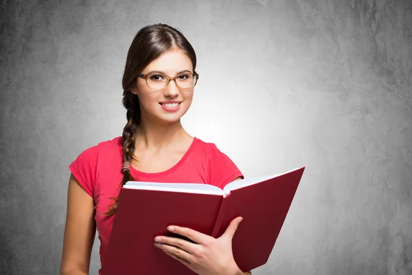 Woman holding book Stock Photo