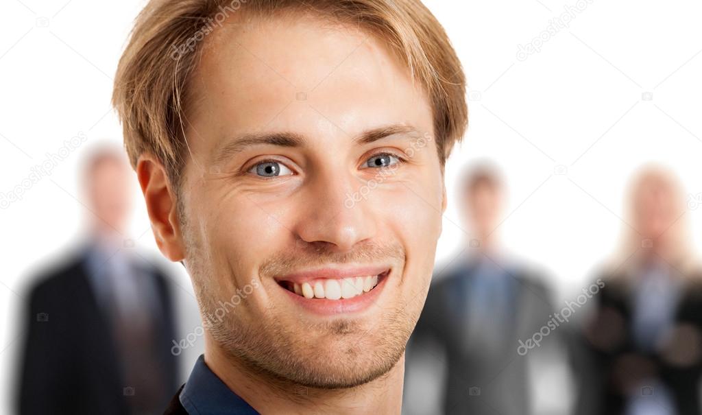 Smiling businessman in front of his team