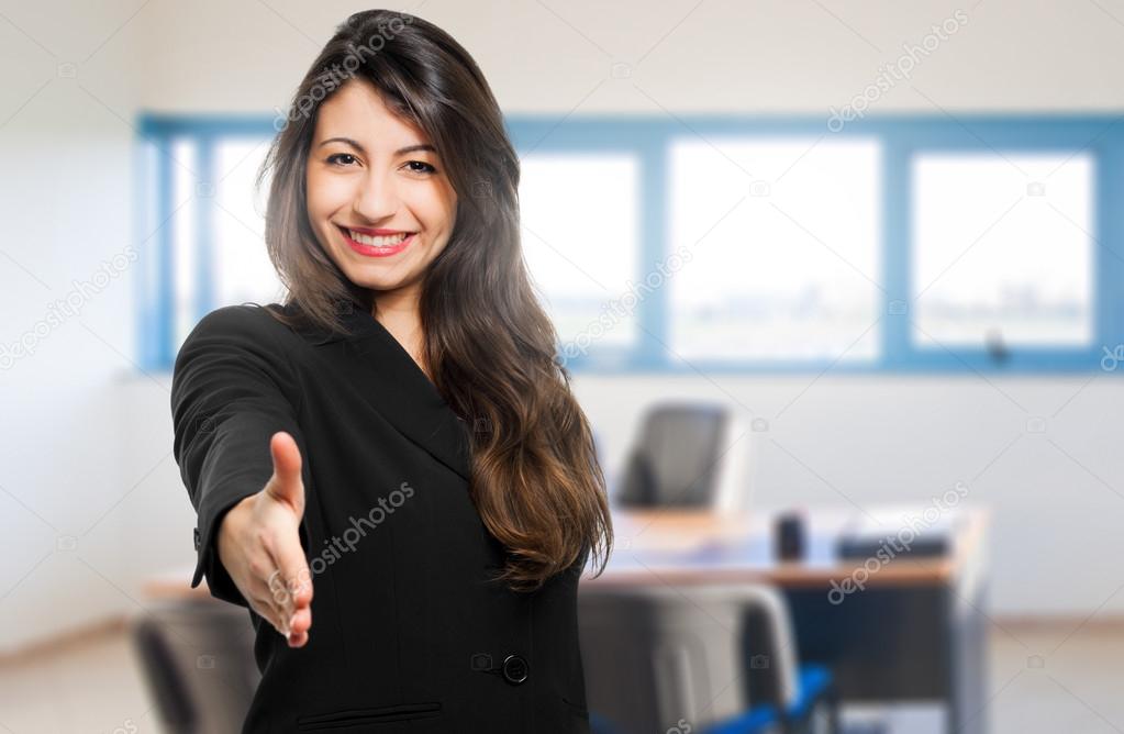 Smiling businesswoman giving hand