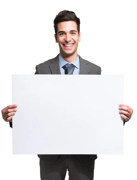 Empresário segurando placa branca — Fotografia de Stock