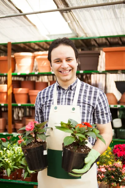 Man holding flower pots — Stock Photo, Image