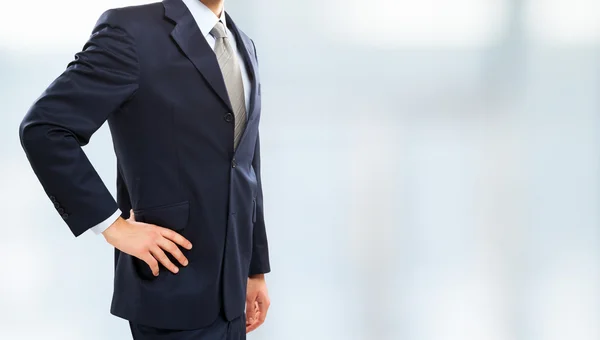 Businessman against a bright background — Stock Photo, Image