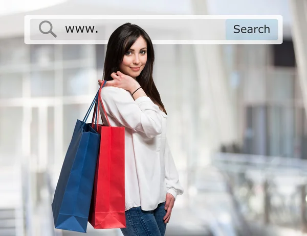 Young woman holding shopping bags