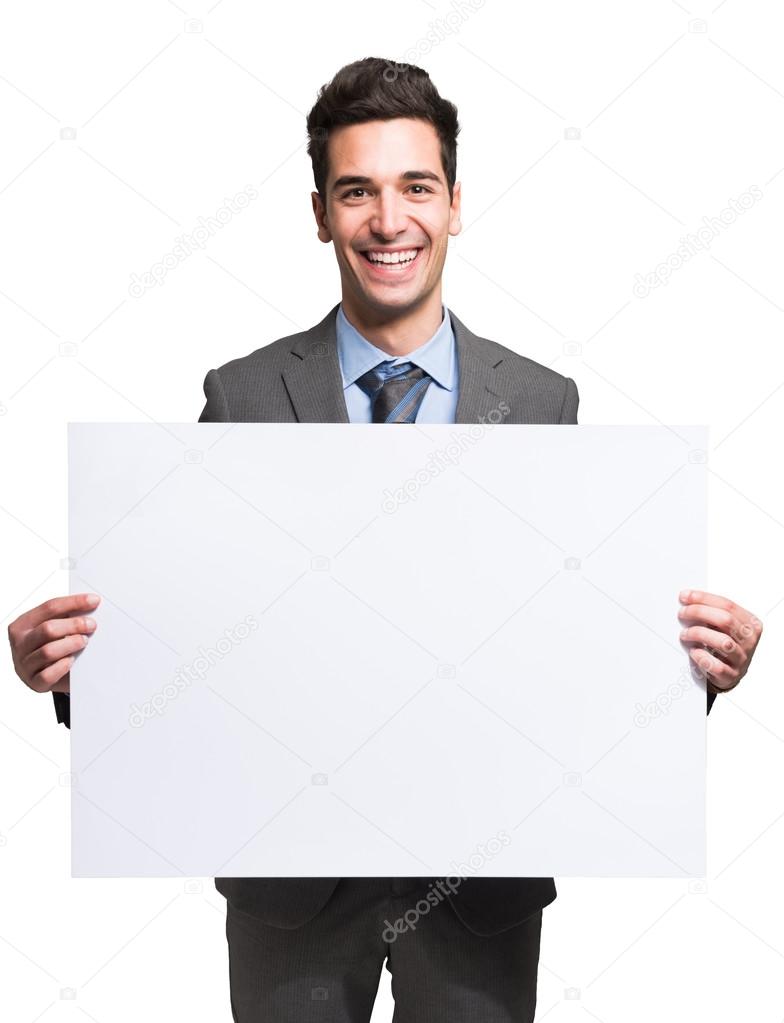 Businessman holding white board