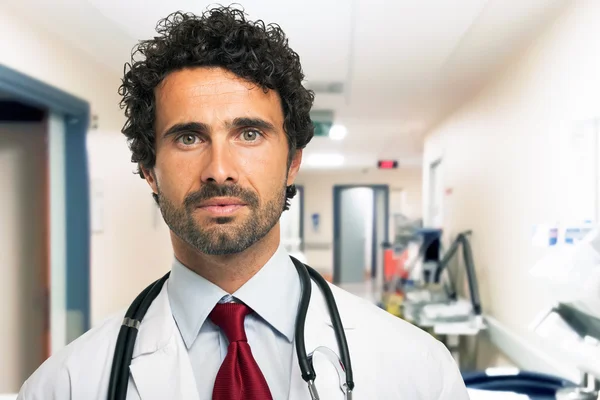 Handsome doctor in an hospital — Stock Photo, Image