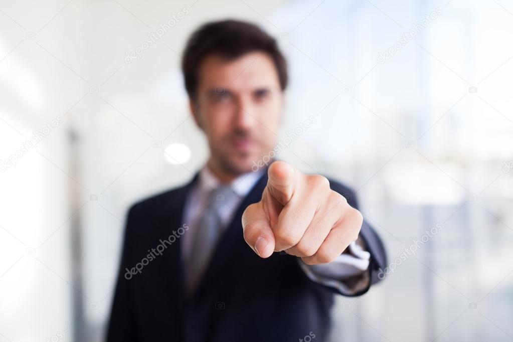 Businessman pointing his finger to you