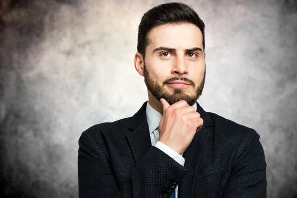 Ung fundersam affärsman — Stockfoto