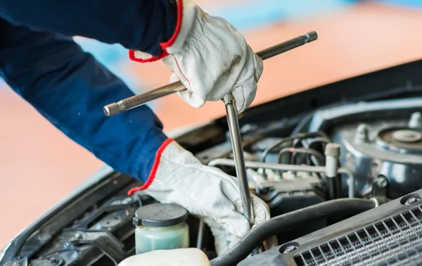 Mechanic repairing a car Stock Photo