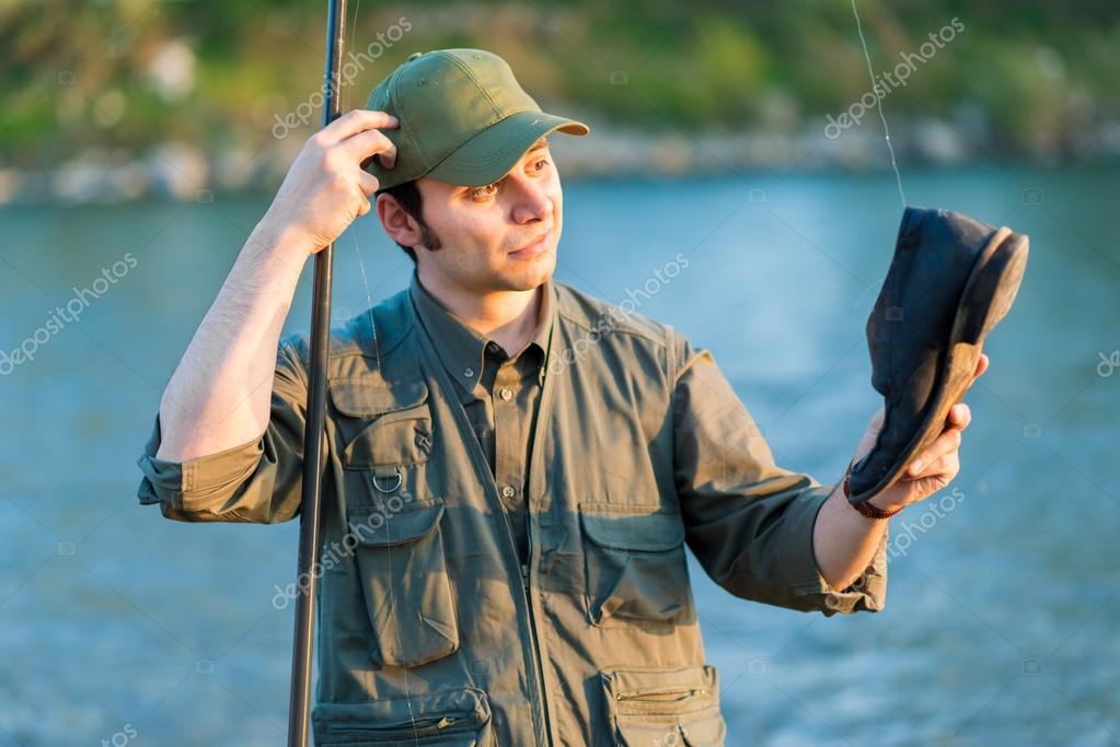 Fisherman caught shoe in river — Stock Photo © minervastock 73028095