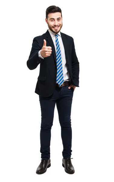 Amigável homem de negócios mostrando polegar para cima — Fotografia de Stock