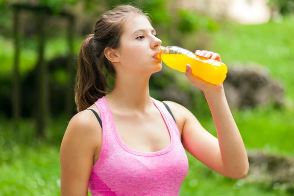 Woman drinking after sport — Stock Photo, Image