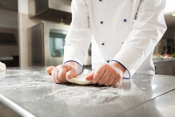 Chef preparing pastry in his kitchen