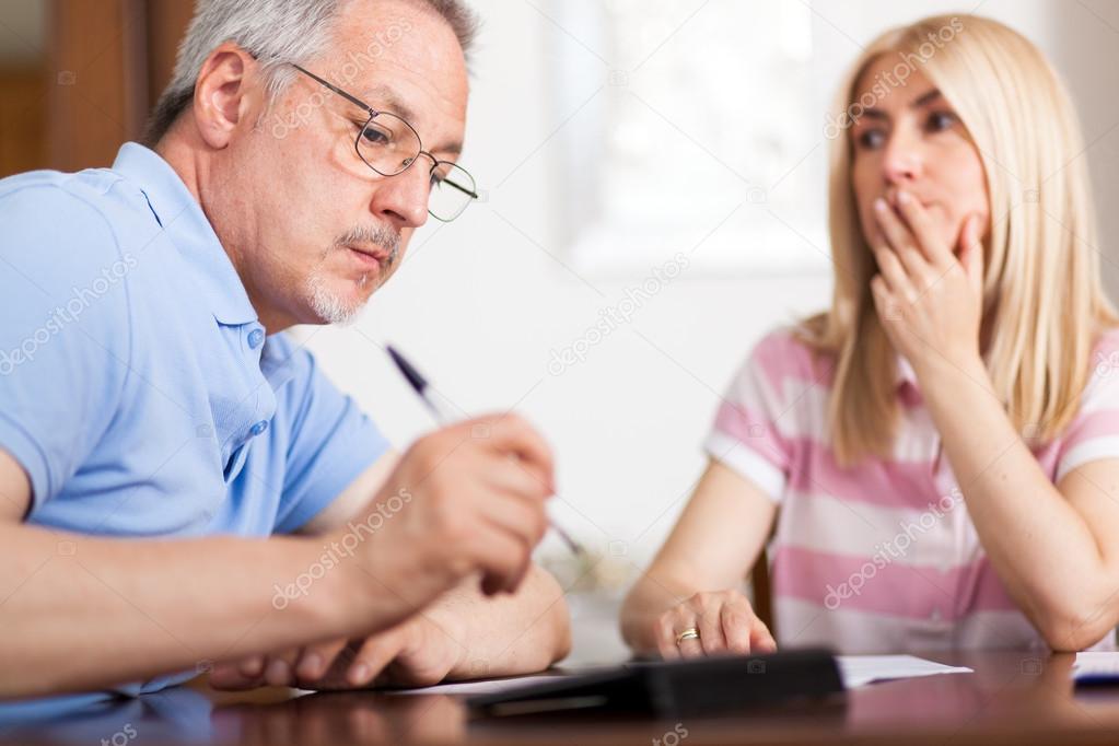 couple checking finances looking at bills