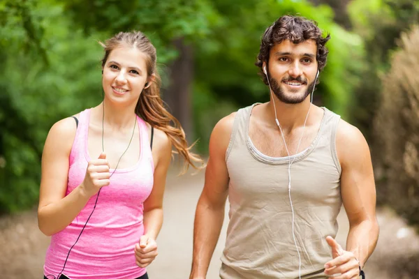 Couple running in park — Stock Photo, Image