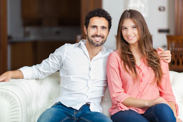 Couple on the sofa in love — Stock Photo, Image