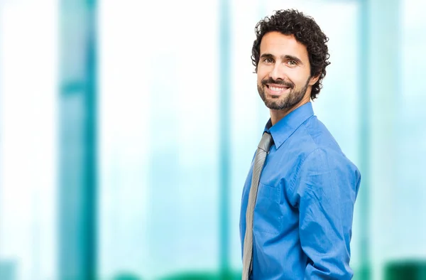 Handsome businessman smiling — Stock Photo, Image