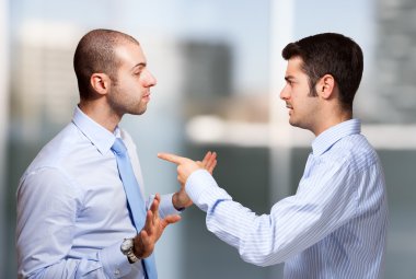 Businessman scolding a colleague clipart