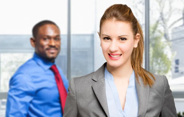 Smiling couple of business people — Stock fotografie