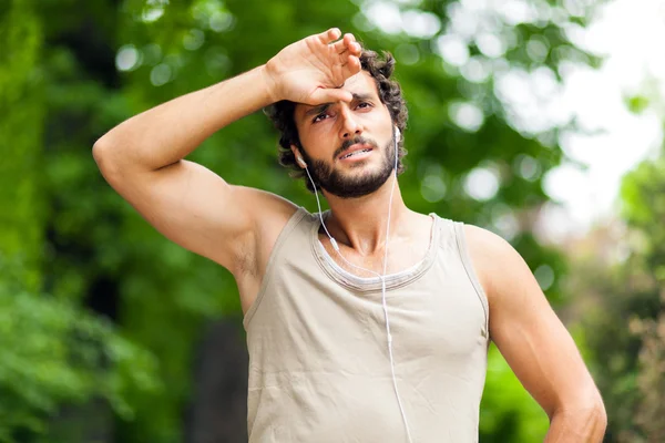 Tired athlete taking rest — Stock Photo, Image