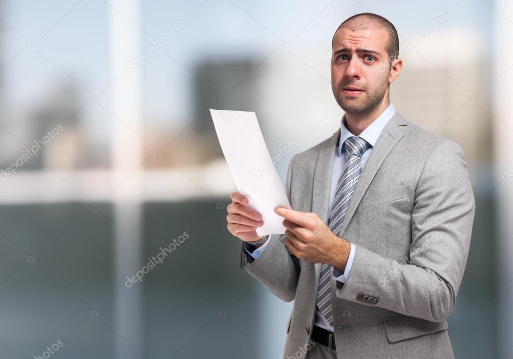 businessman holding document
