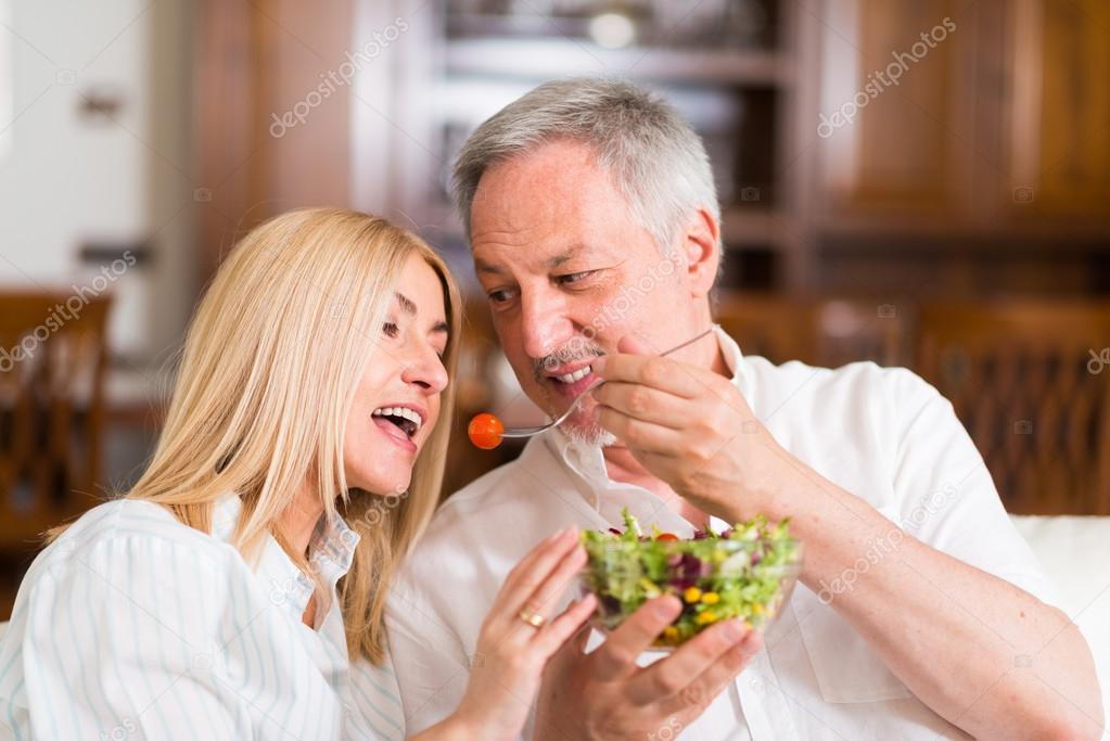 Mature couple eating a salad
