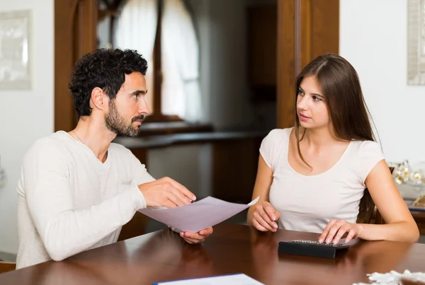 Couple calculating their expenses — Stock Photo, Image