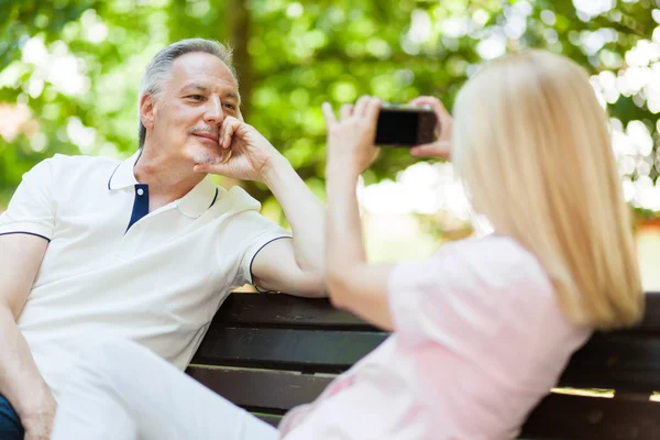 Wife using a compact camera — Stockfoto