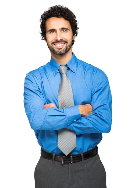 Businessman with crossed arms smiling — Stockfoto