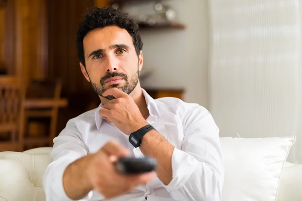 Man choosing the right TV program — Stock Photo, Image