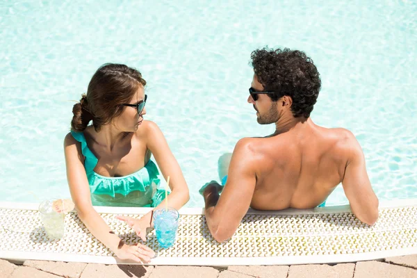 Couple speaking while in the pool — Stock Photo, Image