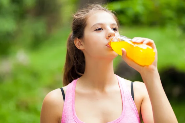 Woman drinking after sport — Stock Photo, Image