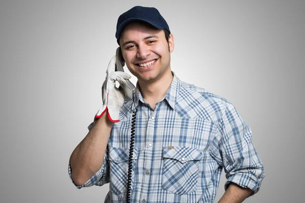 Handwerker telefoniert — Stockfoto