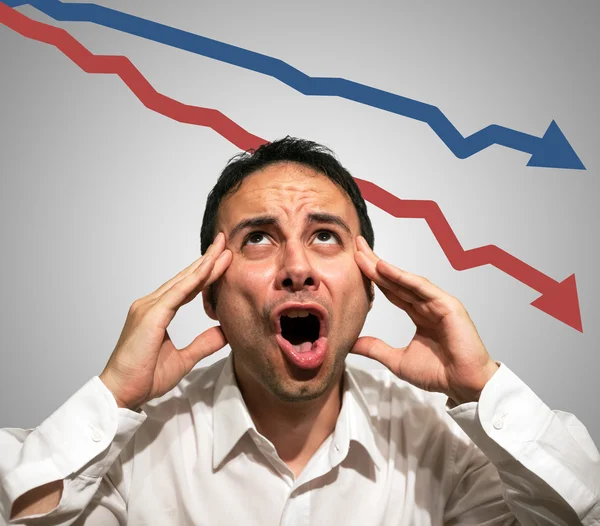 Desperate man in front of falling arrows Stock Image