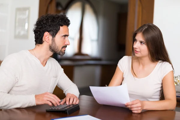 Couple calculating their expenses — Stock Photo, Image