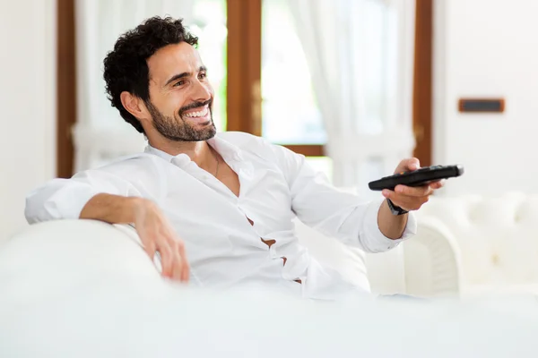 Man choosing the right TV program — Stock Photo, Image