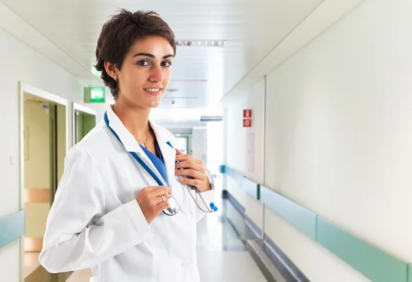 Smiling doctor in her hospital — Stock Photo, Image