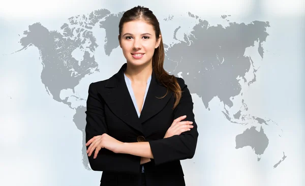 Mujer de negocios en frente del mapa del mundo —  Fotos de Stock