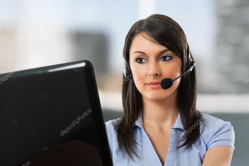 Smiling woman using an headset