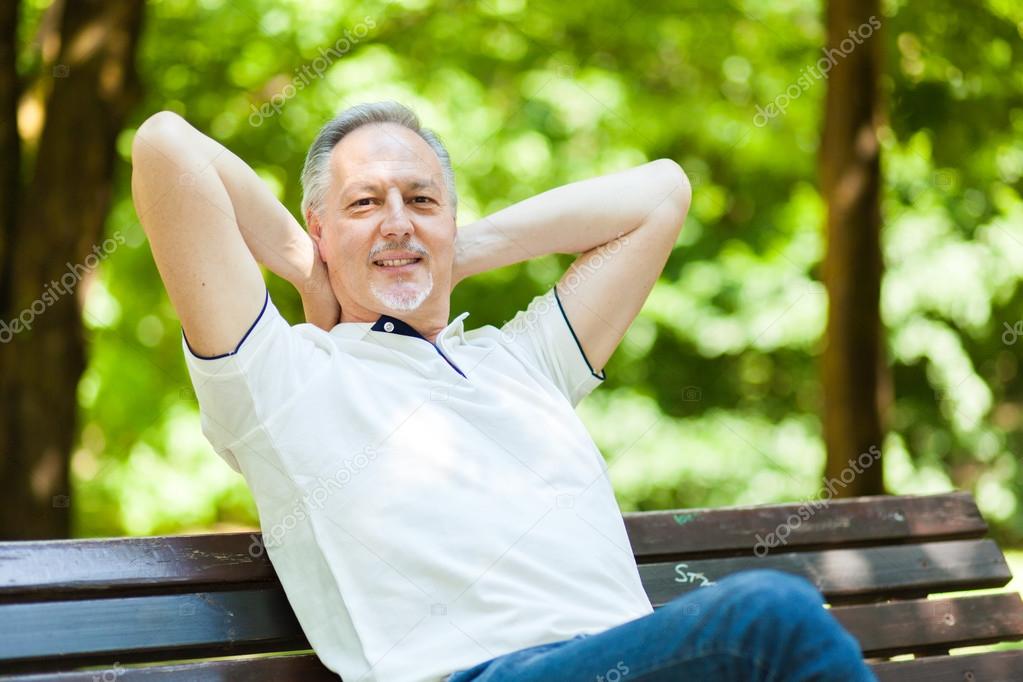 Senior man relaxing at park